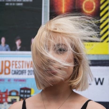 Blond girl with wind blown hair